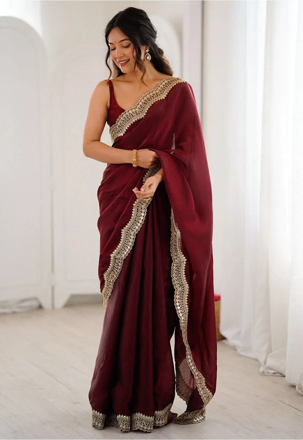 Maroon organza saree with zari border